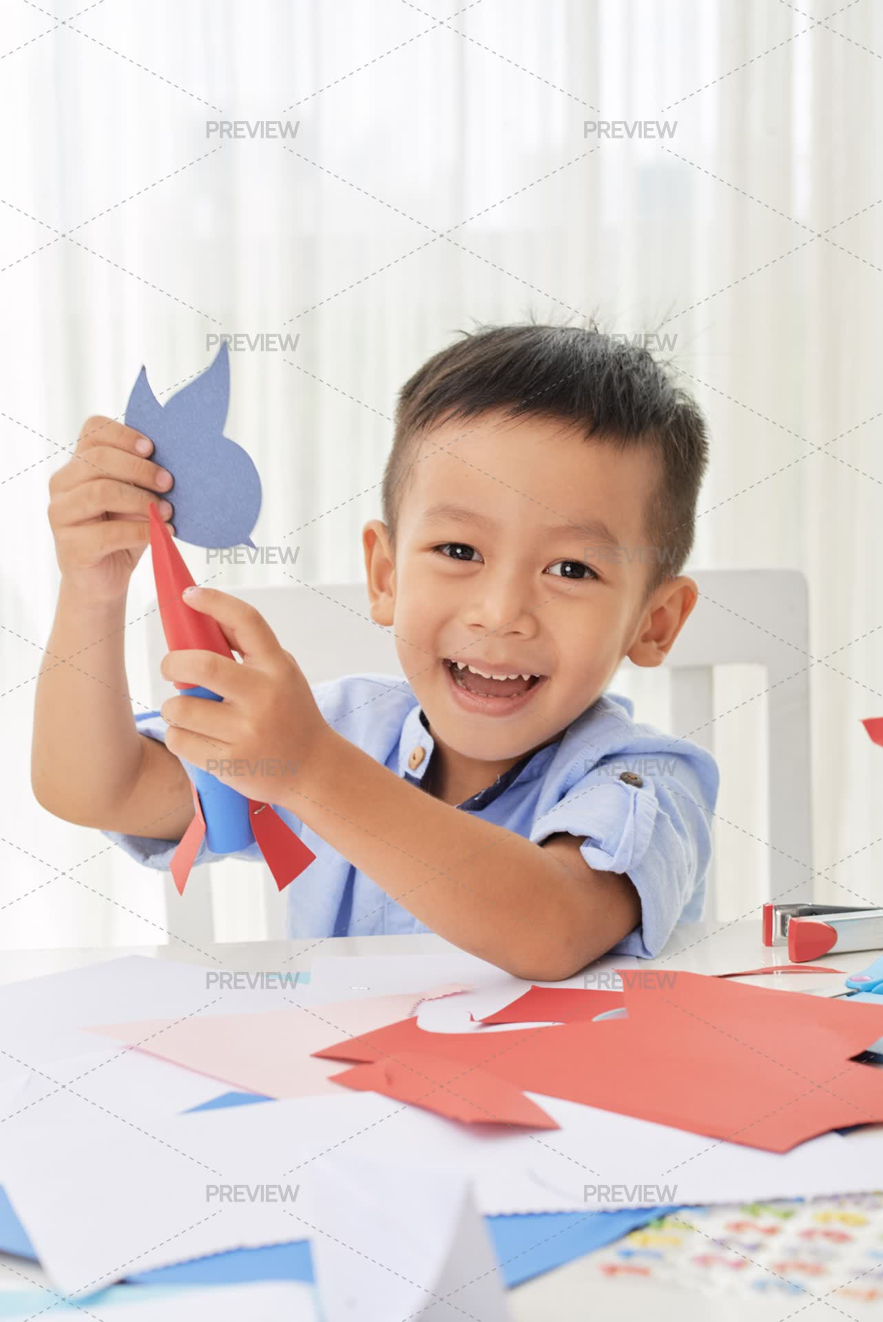 Boy Using Paper Cute Boy Playing With Paper... by DragonImages - Stock Photos | Motion ...