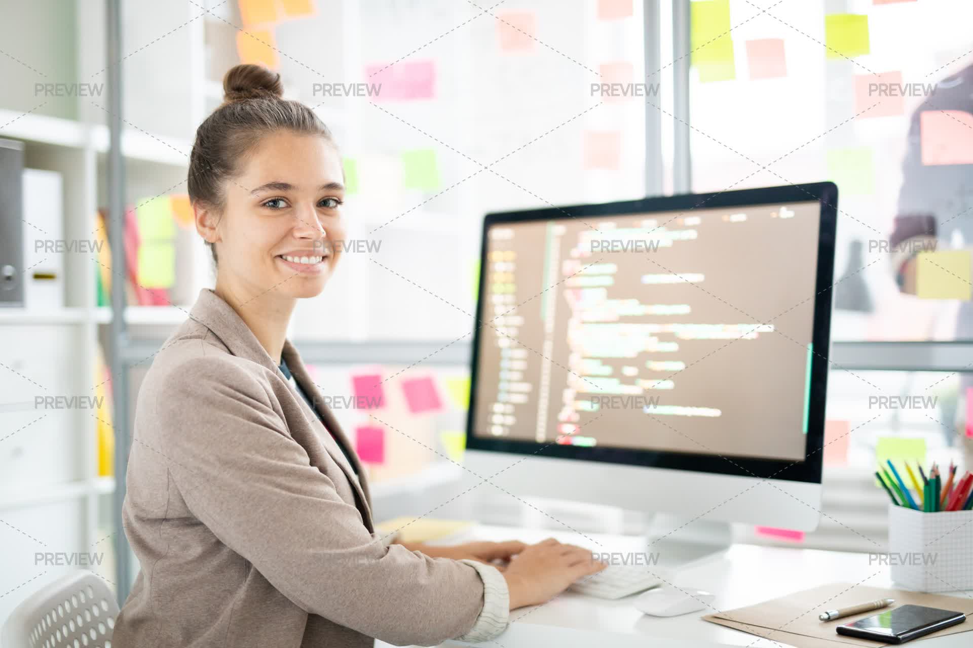 A Pretty Computer Programmer Cheerful Programmer by SeventyFour - Stock Photos | Motion Array